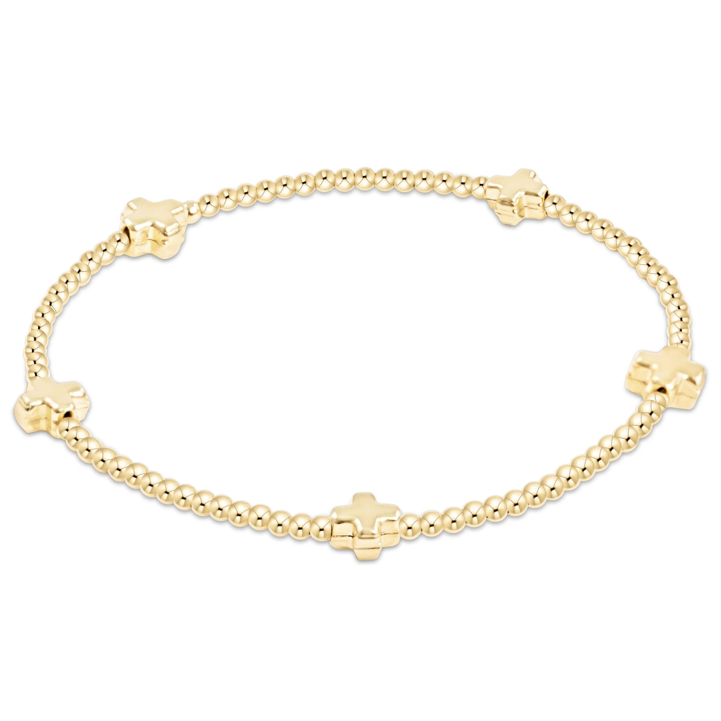 Gold beaded bracelet with small crosses