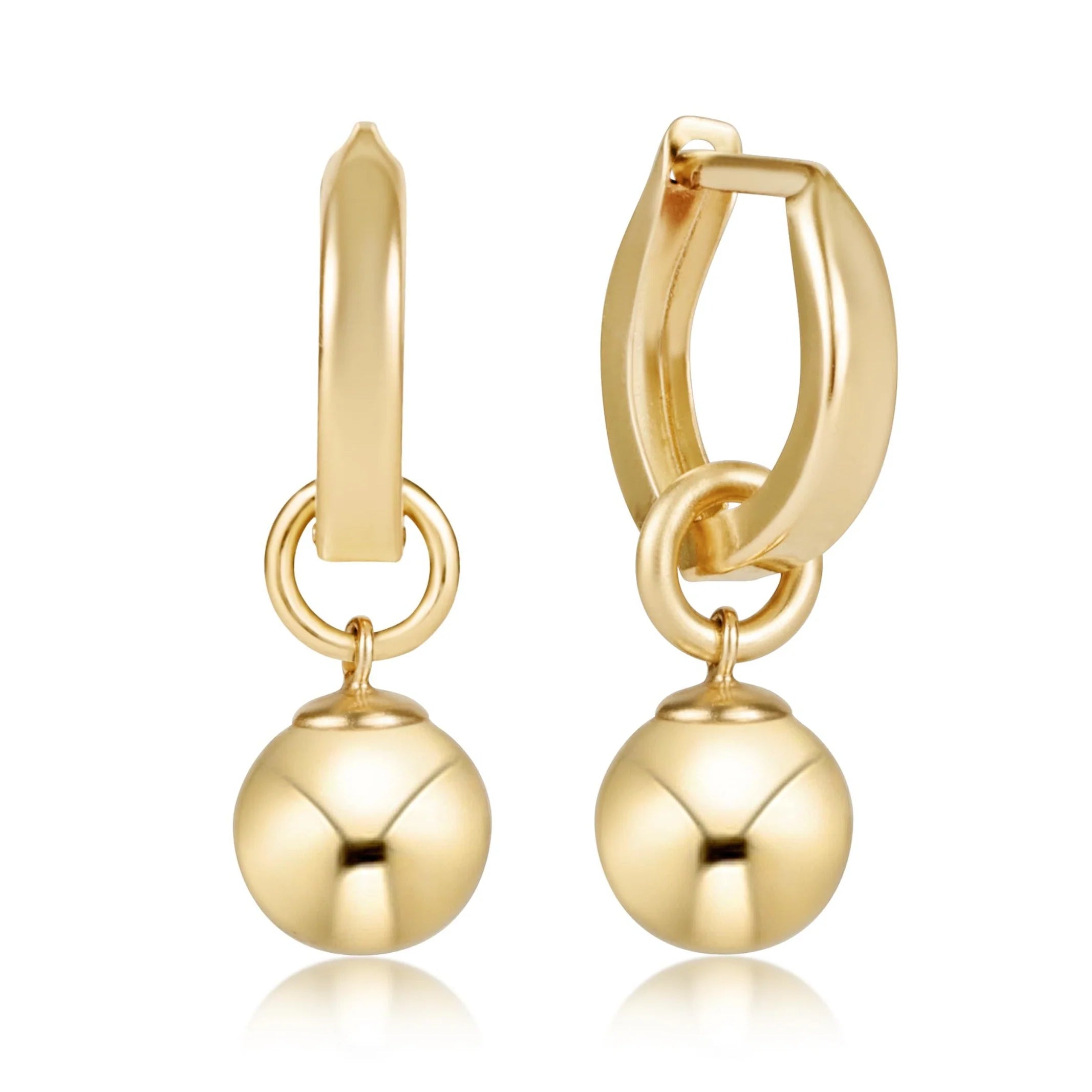 Gold hoop earrings with spherical charms on a white background