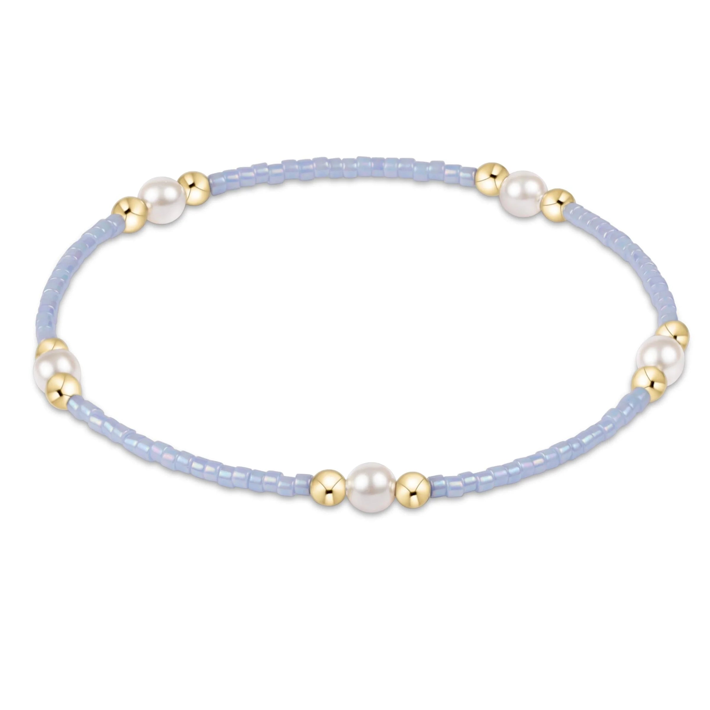 Bracelet with light blue beads, gold accents, and pearls on a white background