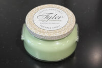 Tyler Candle Company candle with leopard print lid on a dark background