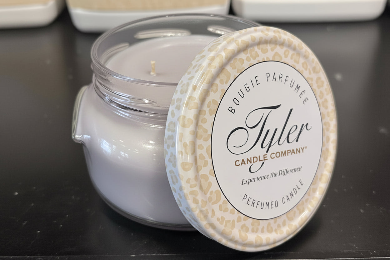 Tyler Candle Company candle with a decorative lid on a dark surface