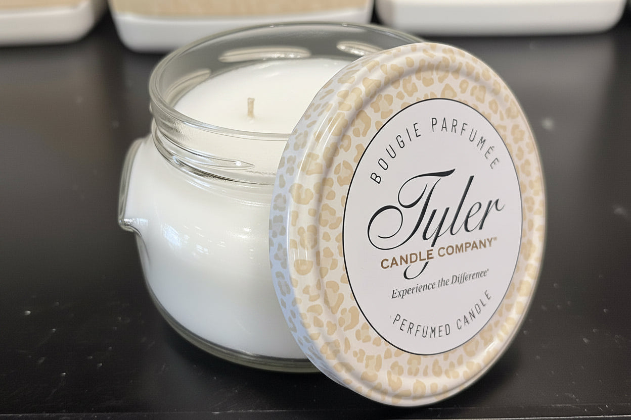 Tyler Candle Company candle with a decorative lid on a dark surface