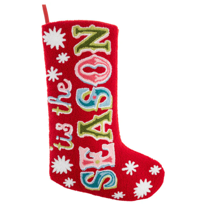 Red Christmas stocking with colorful text and white snowflakes on a white background