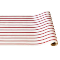 A roll of wrapping paper with horizontal red and black stripes on a white background, shown partially unrolled.