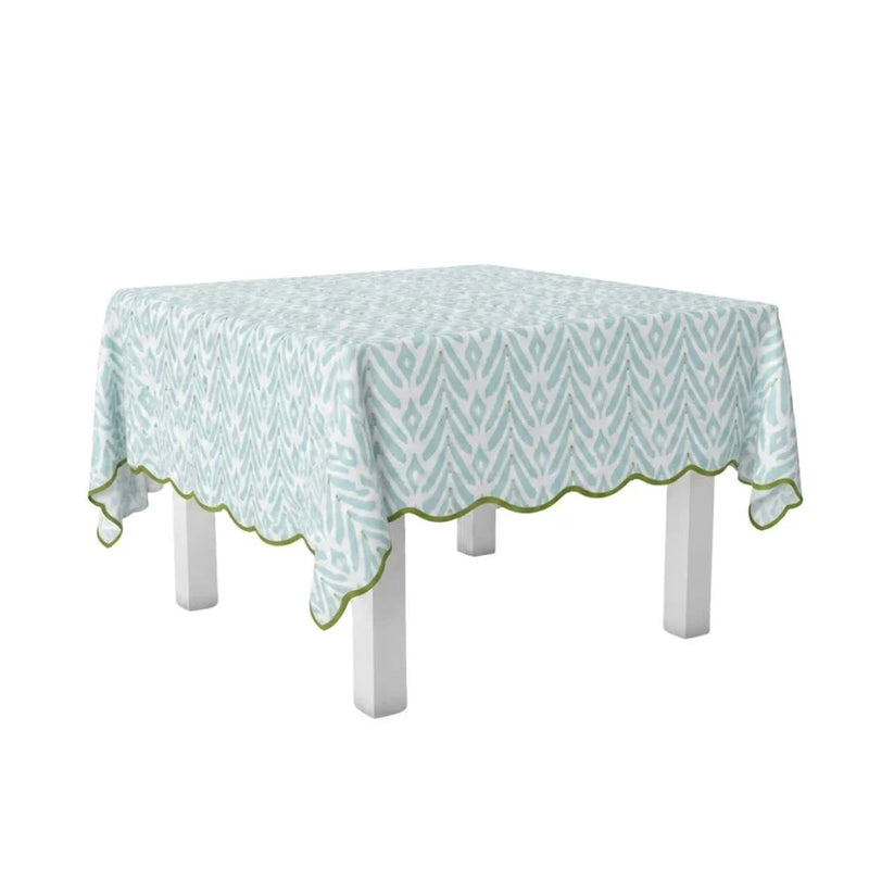 Tablecloth with a green and white pattern on a white table