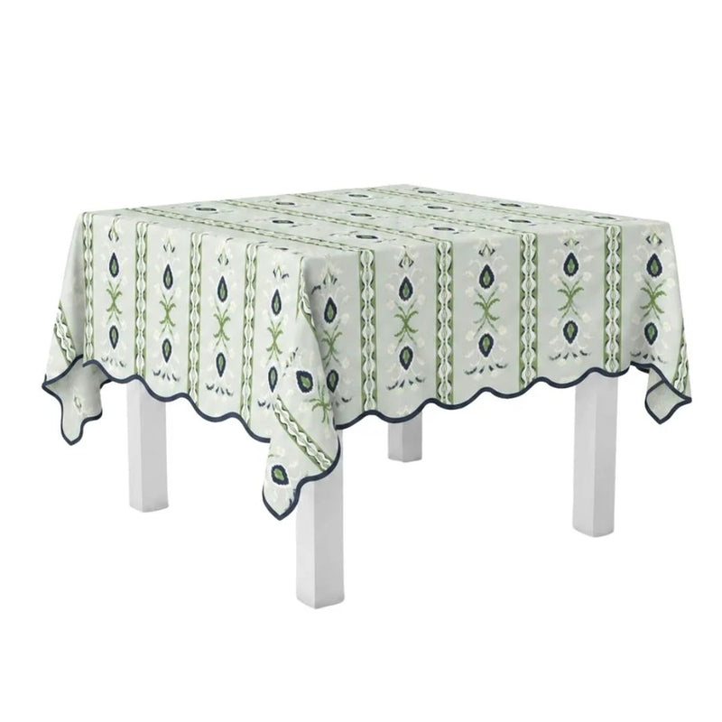 Tablecloth with green floral pattern on a white table