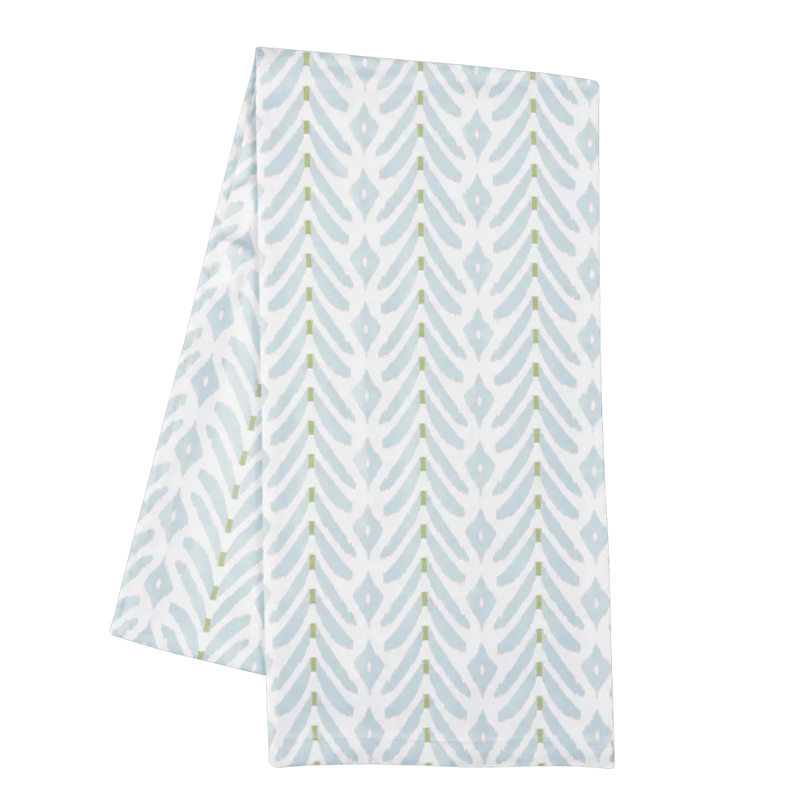 Folded fabric with blue and white geometric pattern on a white background