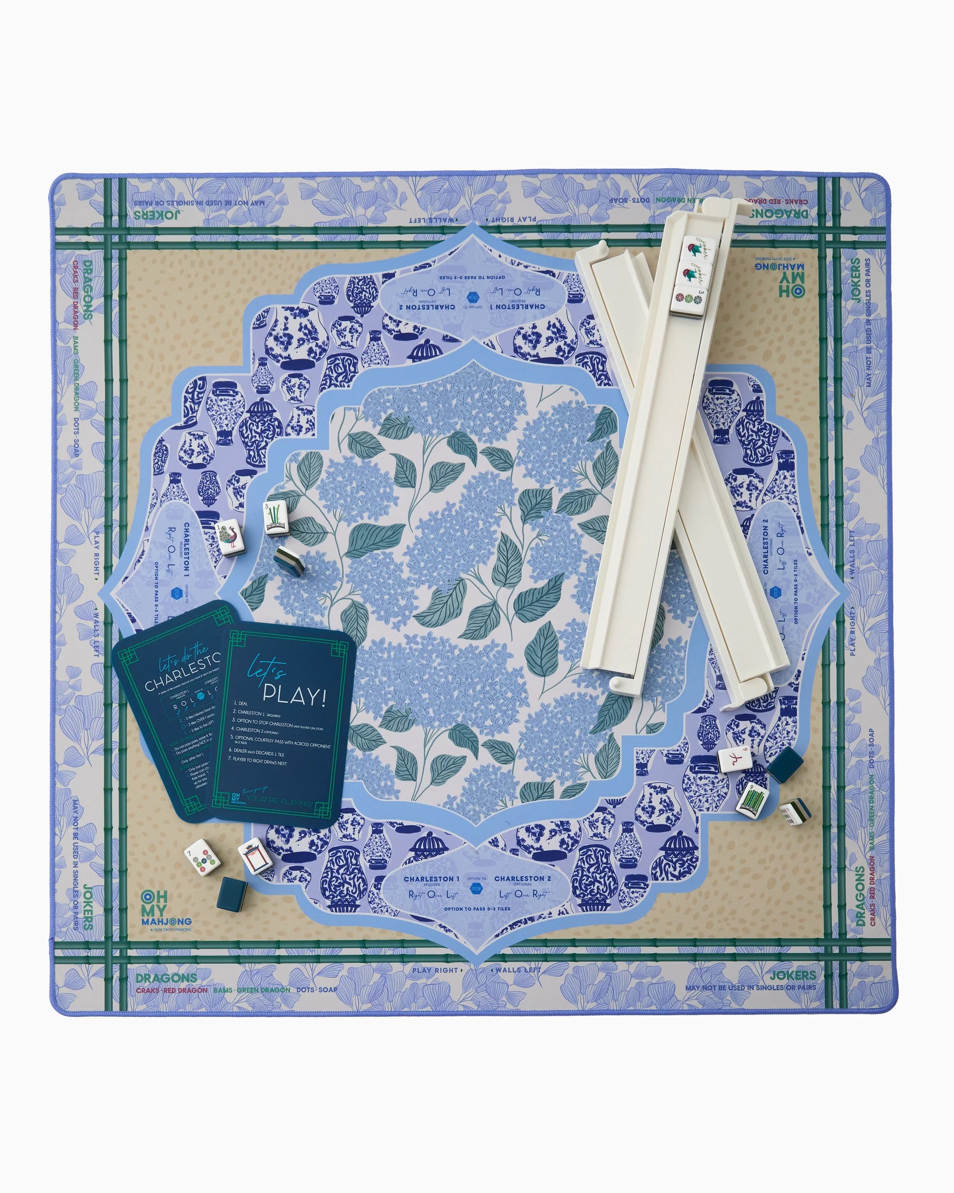 Mahjong Mat set with blue and green floral design on a white background