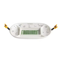A white ceramic football-themed dish with a green field design in the center and black play-call markings, shown on a plain white background.