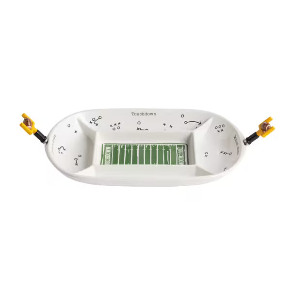 A white ceramic football-themed dish with a green field design in the center and black play-call markings, shown on a plain white background.