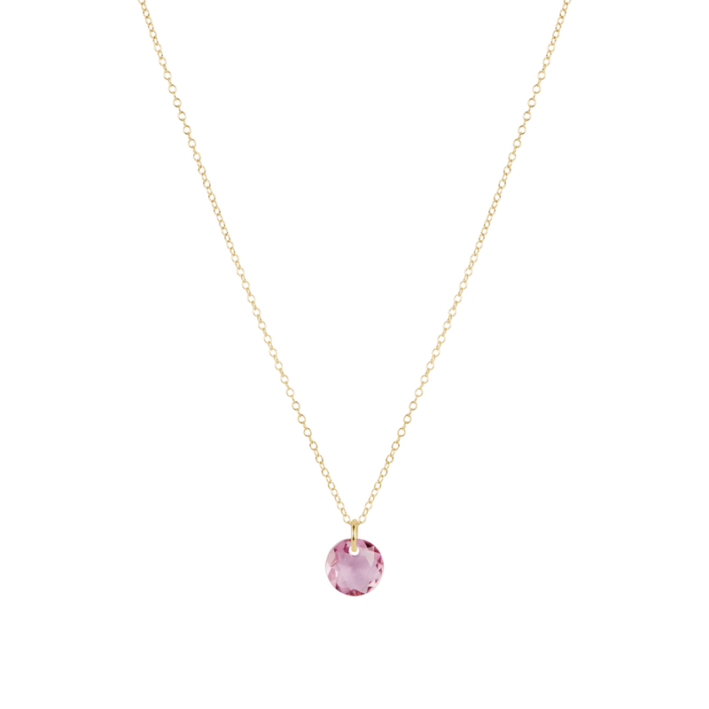 Necklace with a pink gemstone pendant on a white background