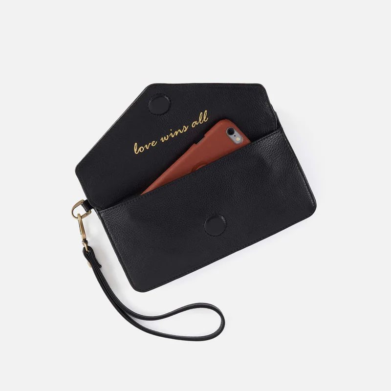 Black phone case with wrist strap and 'love wins all' text on a white background