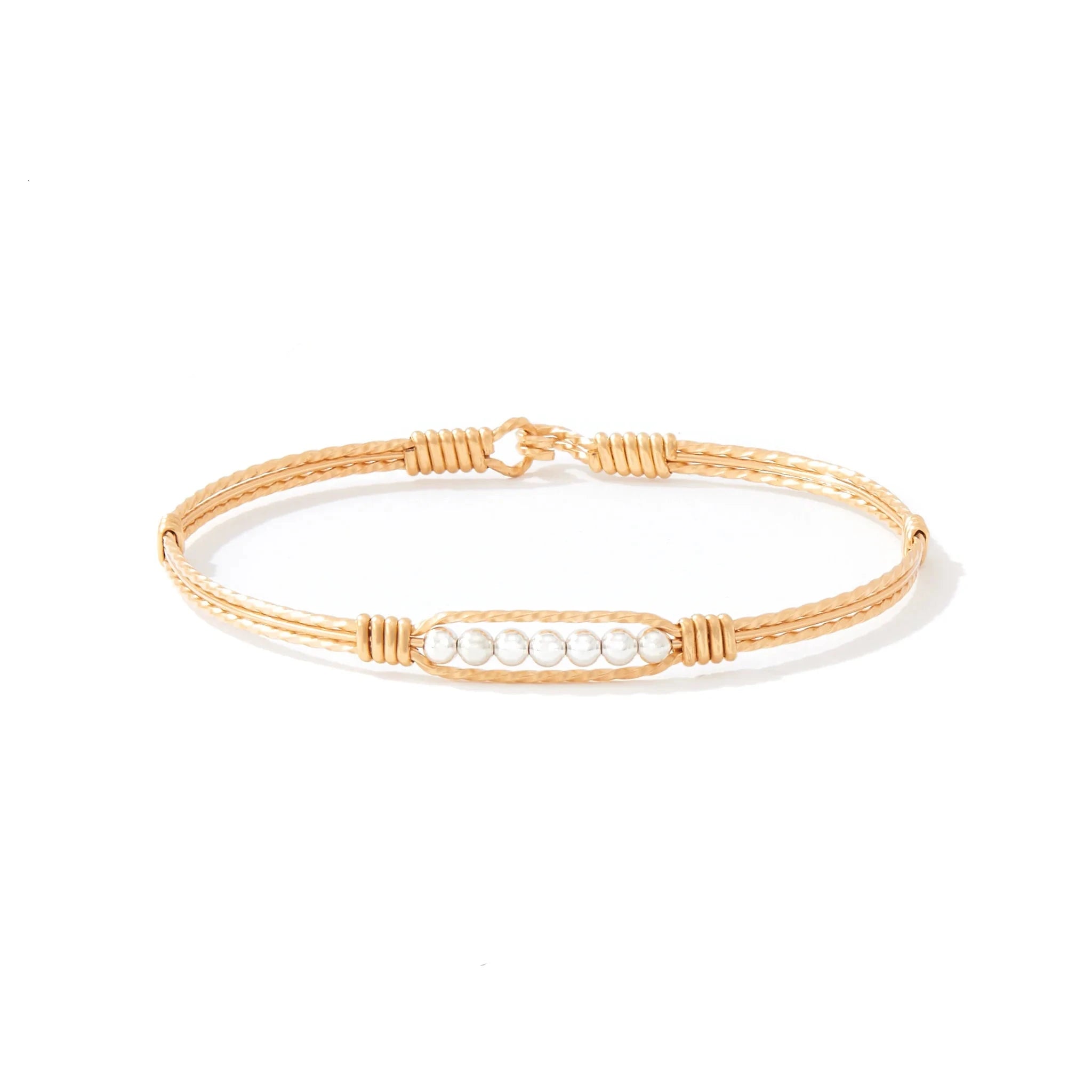Gold bracelet with silver beads on white background