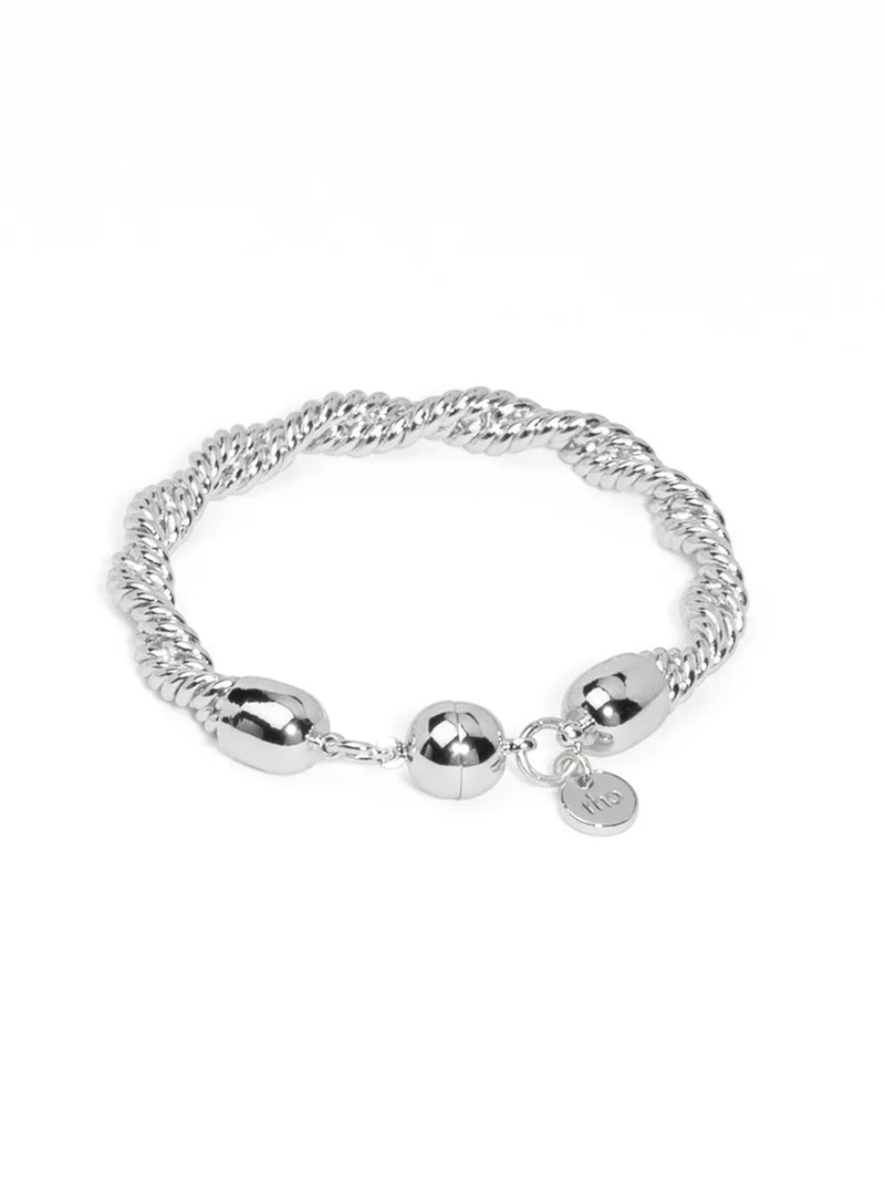 Silver bracelet with beads on a white background