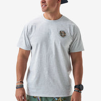 Man wearing a gray t-shirt with a logo on a white background