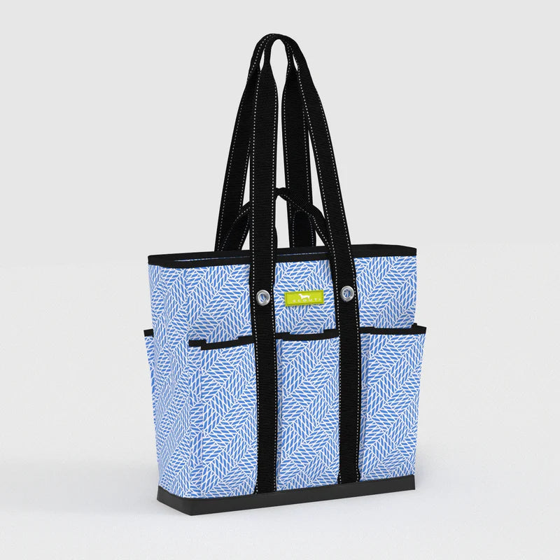 Tote bag with blue pattern and black handles on a light gray background