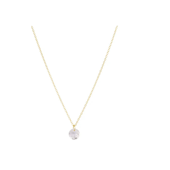 Gold necklace with a clear crystal pendant on a white background