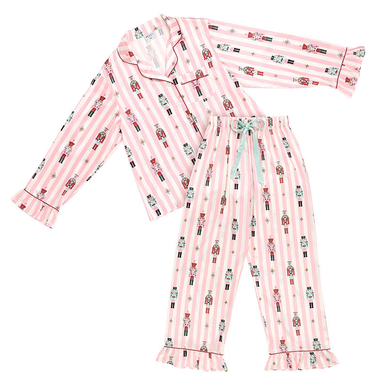 Pink pajama set with nutcracker design on a white background