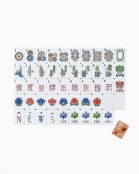 Set of Mahjong tiles with various symbols and numbers on a white background