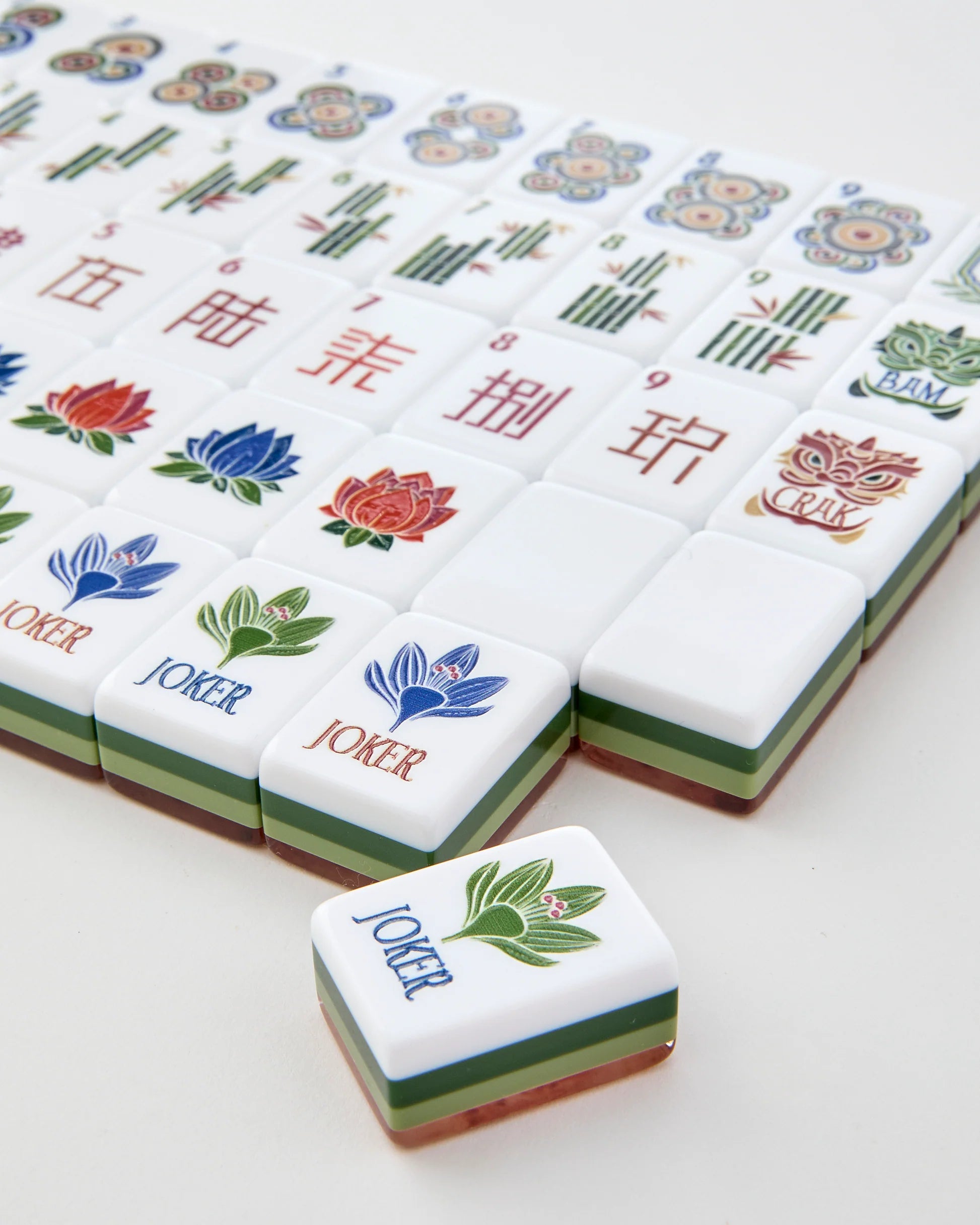 Set of colorful麻将 tiles with 'Joker' tiles on a white background