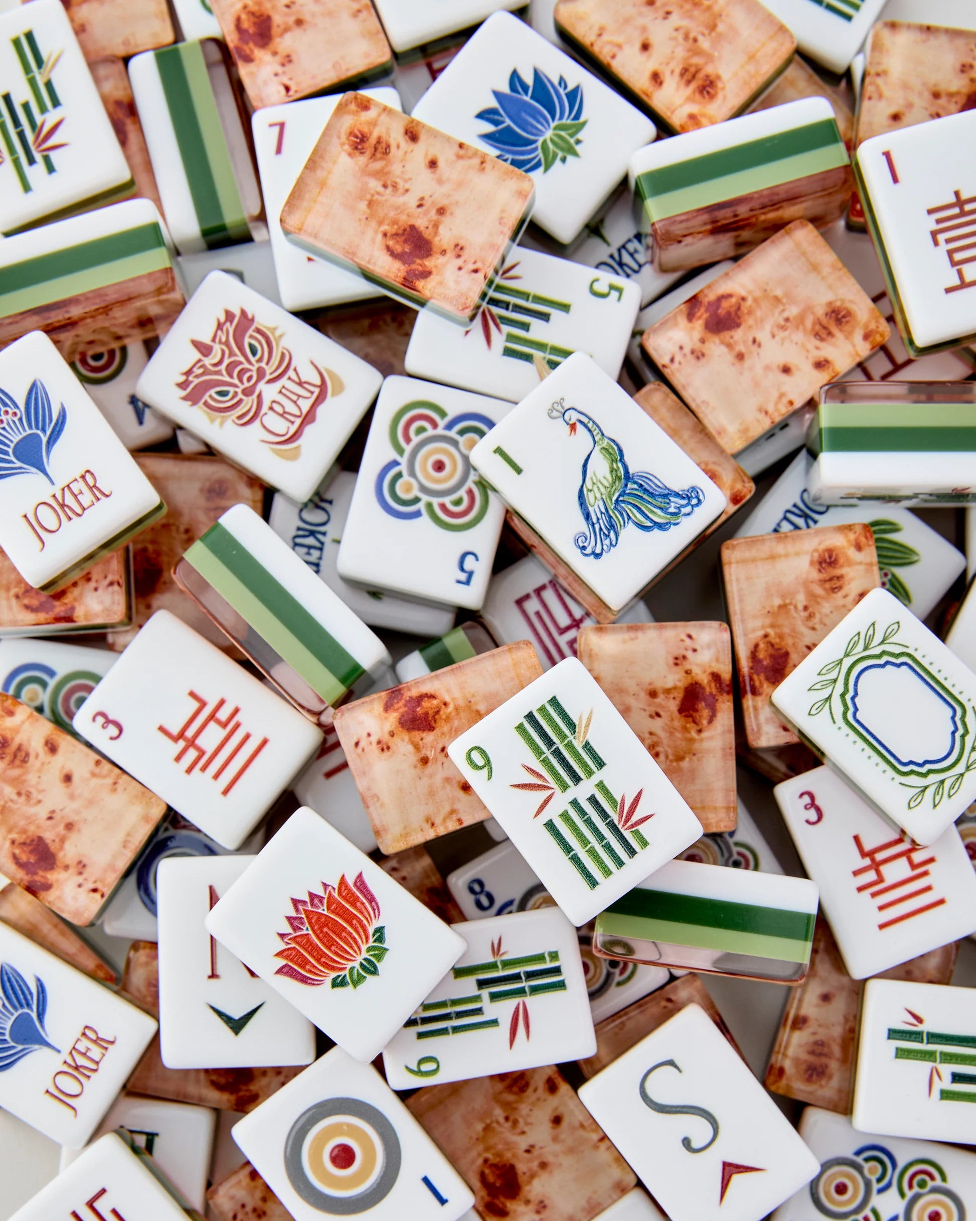 Collection of assorted Mahjong tiles with various symbols and numbers.
