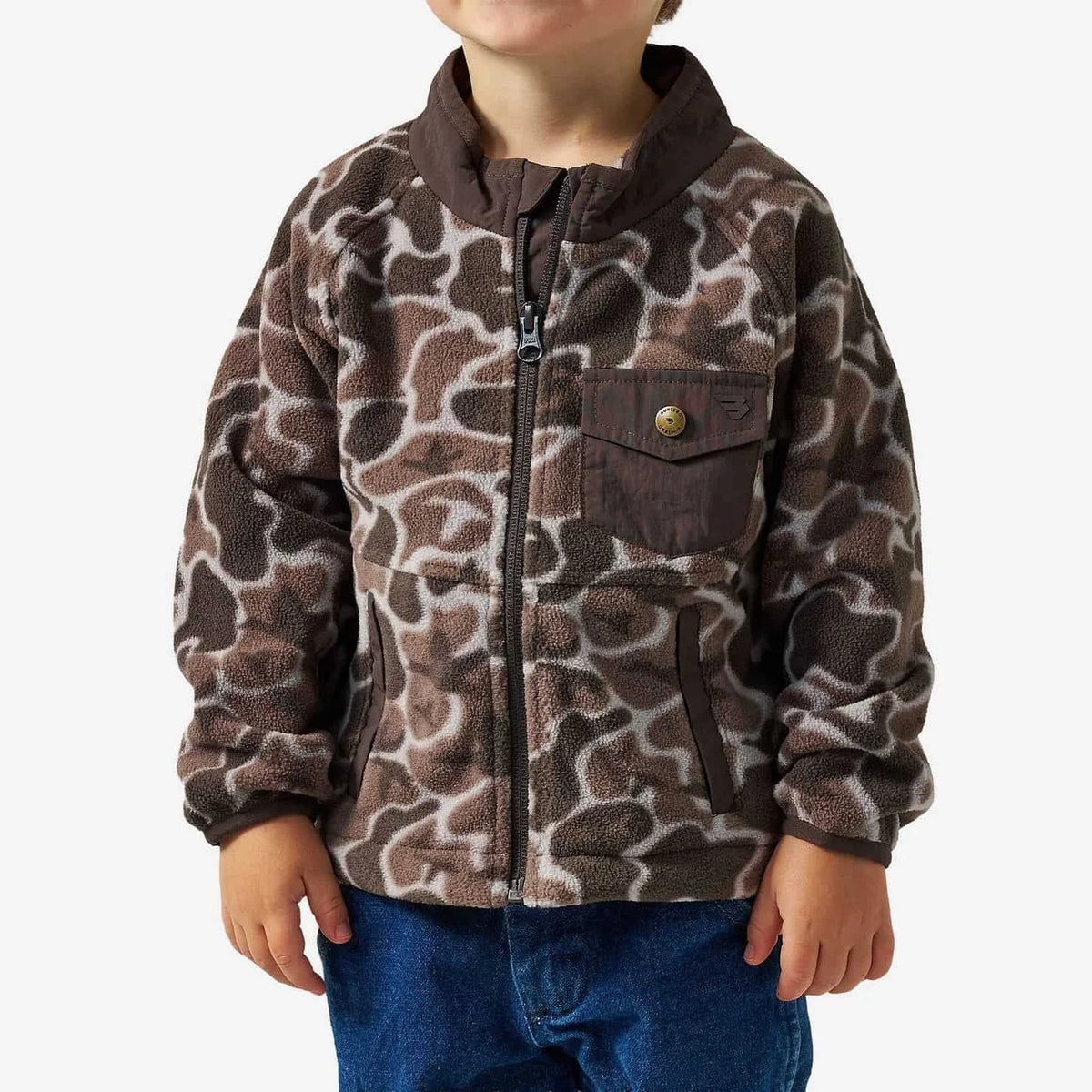 A child wearing a brown and beige animal-print fleece zip-up jacket with a stand collar and chest pocket, paired with blue jeans, against a light gray background.