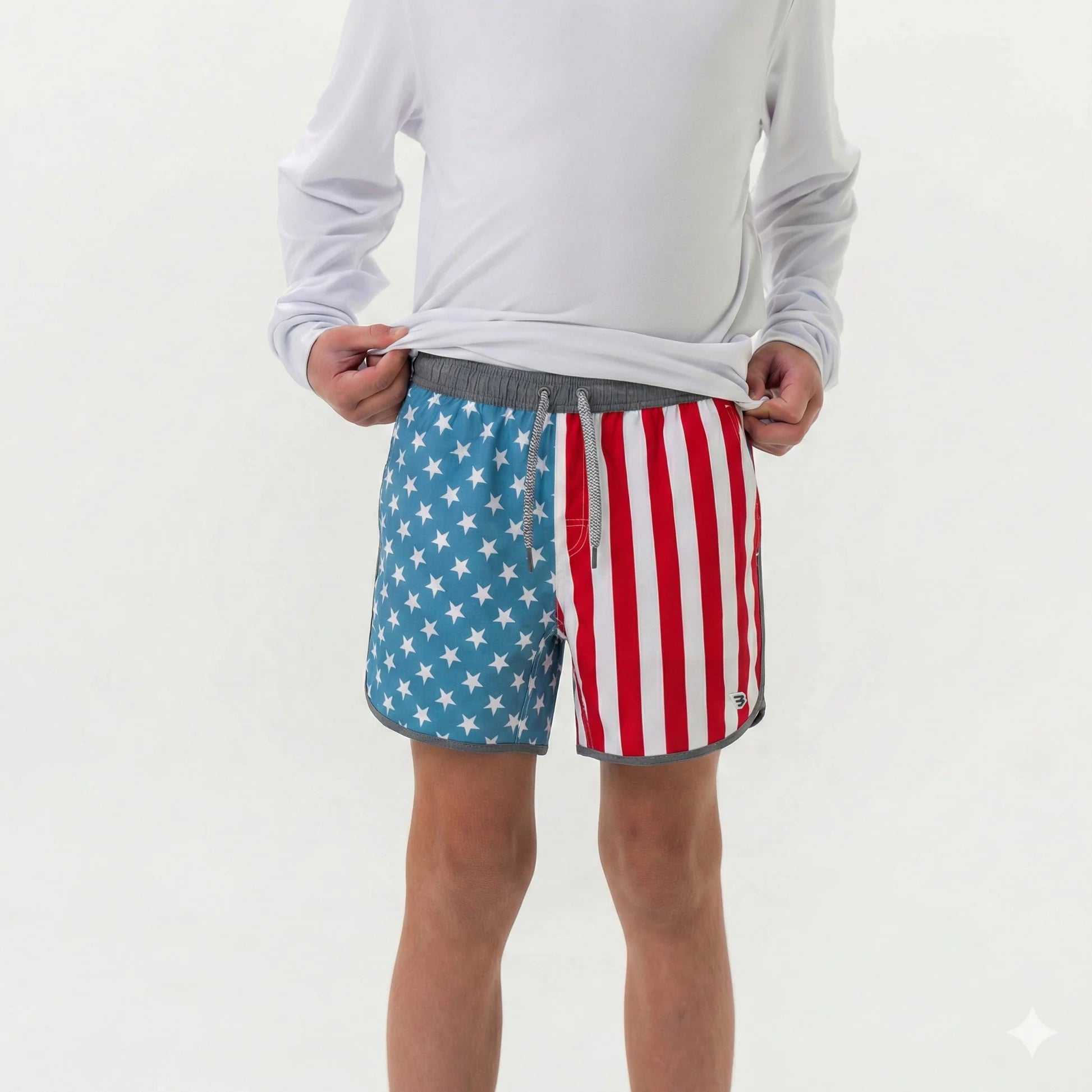 Person wearing American flag patterned shorts on a white background