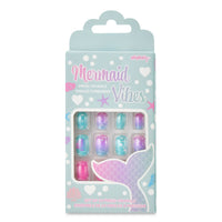 Press on nails in a mermaid theme in a gray box