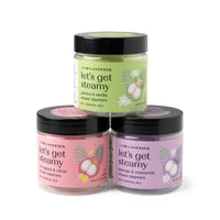 Three jars of 'let's get steamy' shower steamers by Lemon Lavender on a white background.