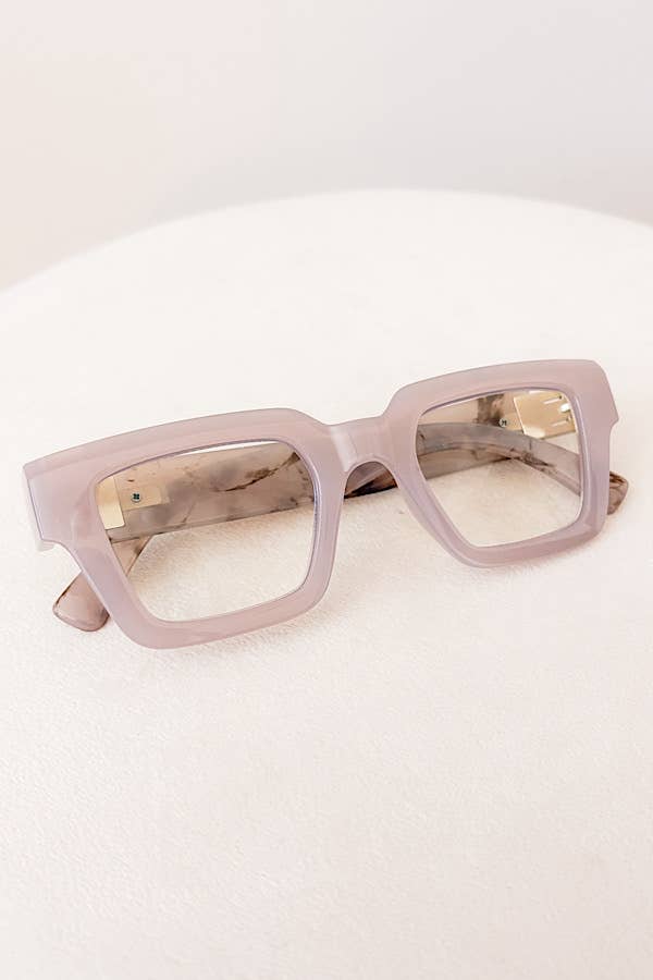 Pink sunglasses on a white background
