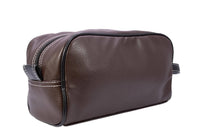 Brown leather toiletry bag on a white background