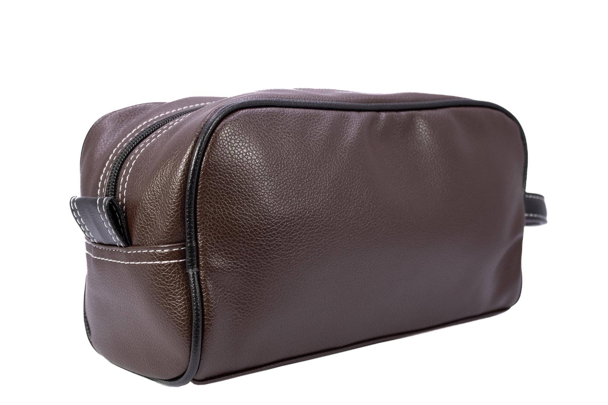 Brown leather toiletry bag on a white background
