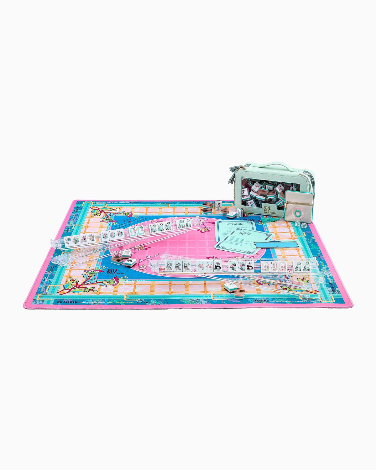 A colorful board game set laid out on a white background, featuring a pink and blue game board, clear play money, and a mint green storage bag