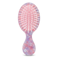 Front of kids hairbrush in pink, purple, and white mosaic