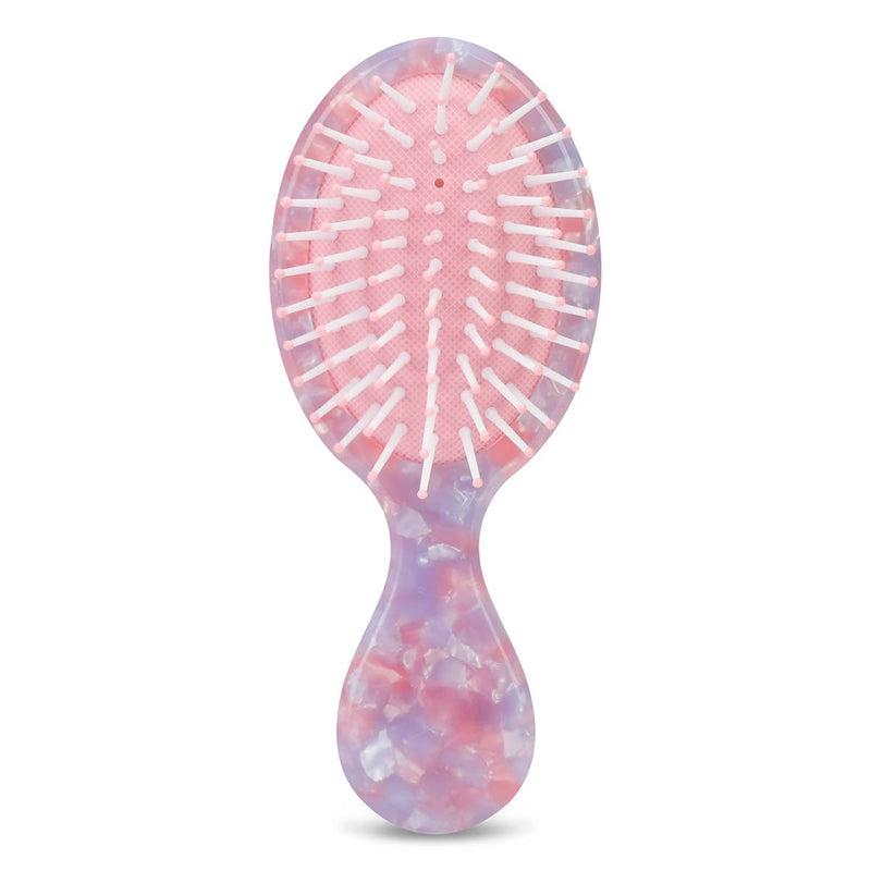 Front of kids hairbrush in pink, purple, and white mosaic