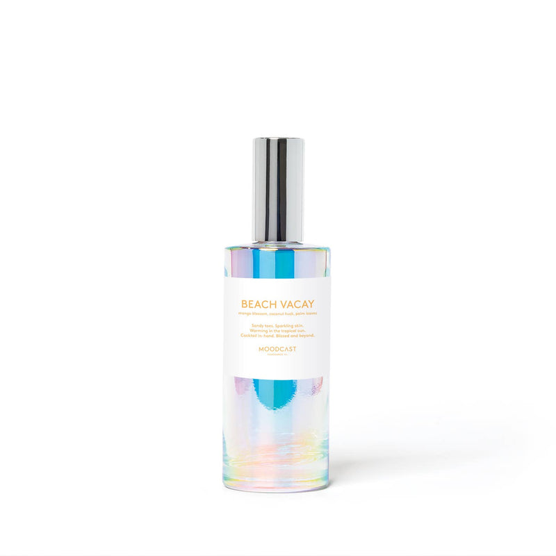 Bottle of 'Beach Vacay' cologne with colorful label on a white background