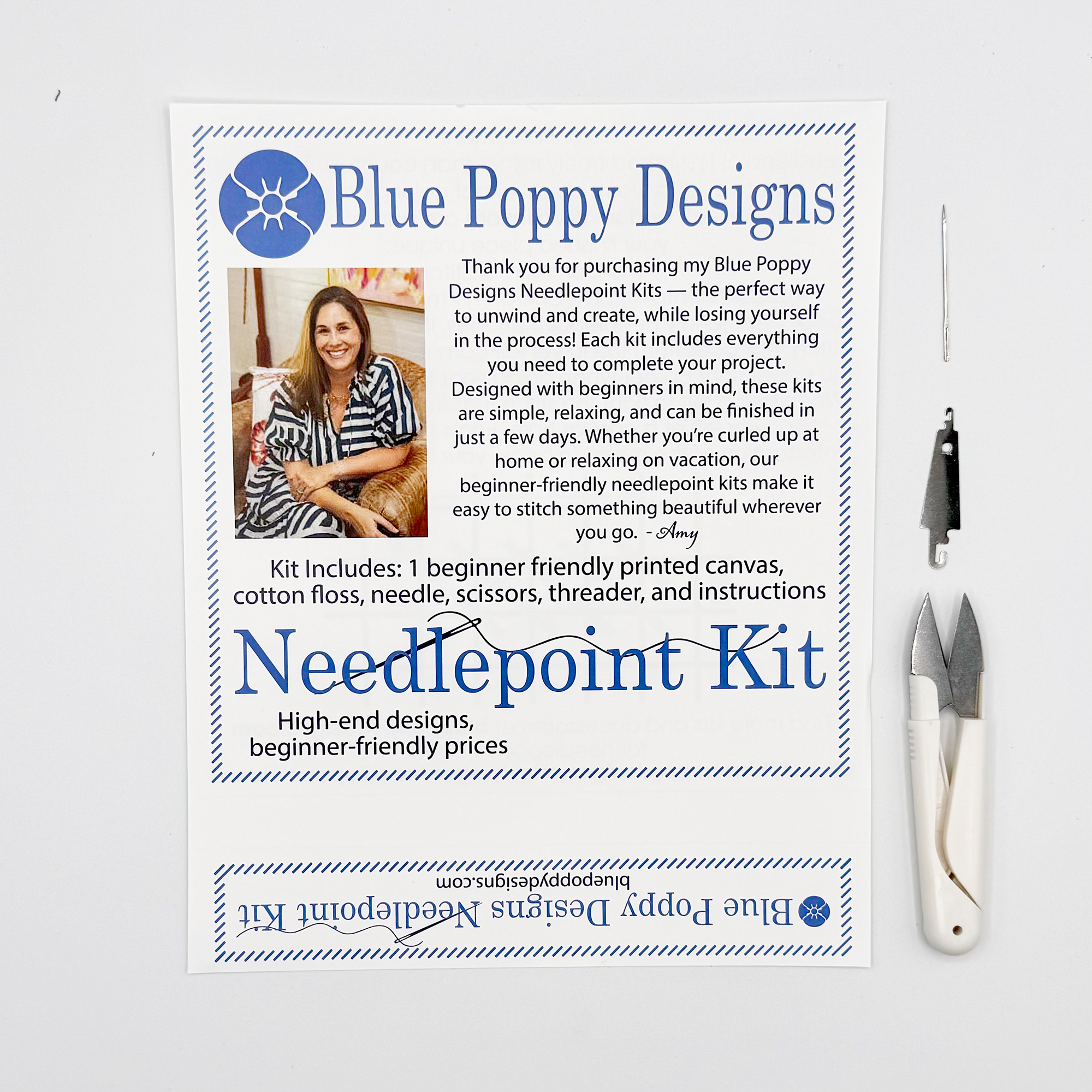 Blue Poppy Designs needlepoint kit with tools on a white background