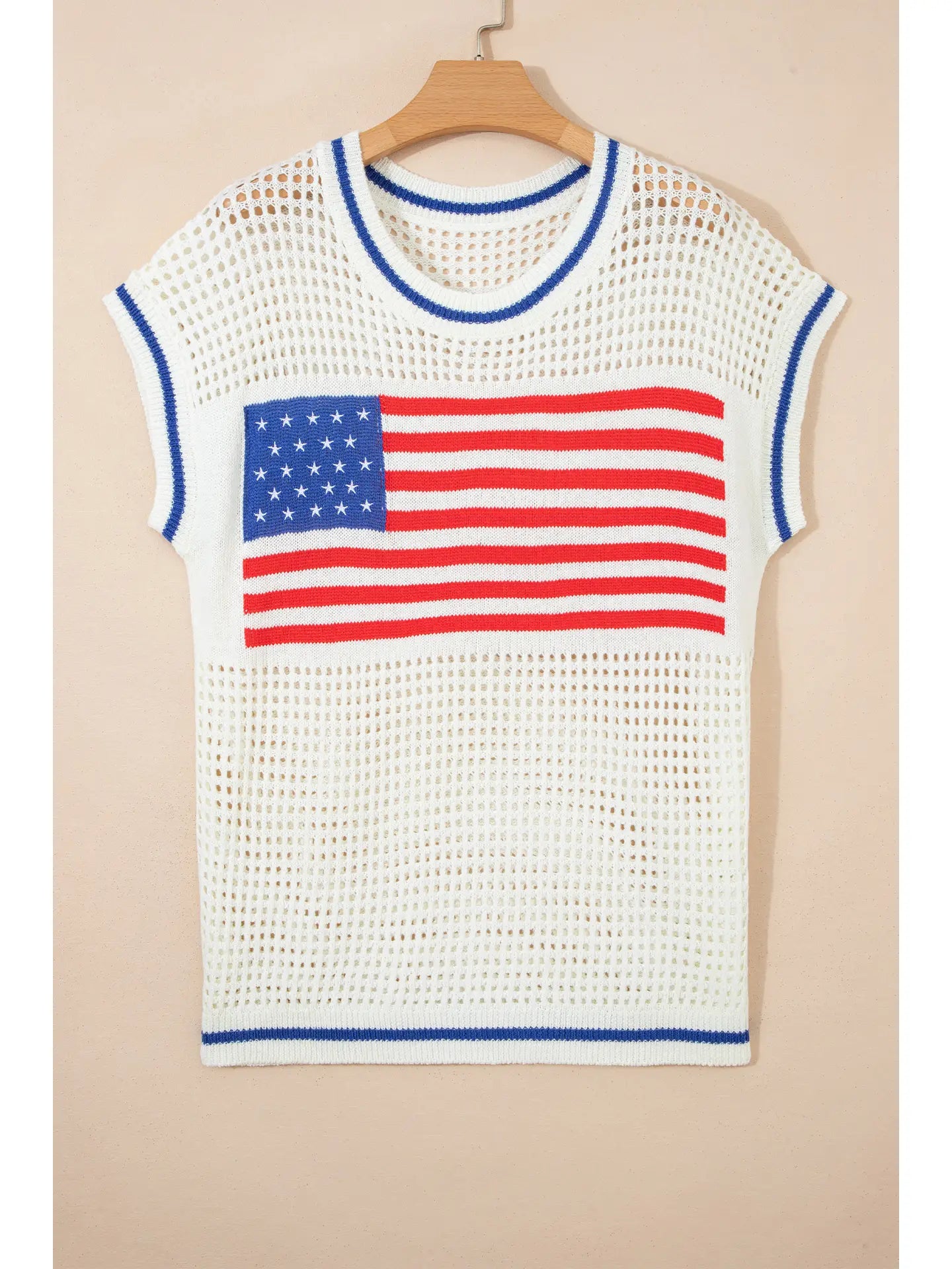 White sleeveless top with American flag design on a beige background