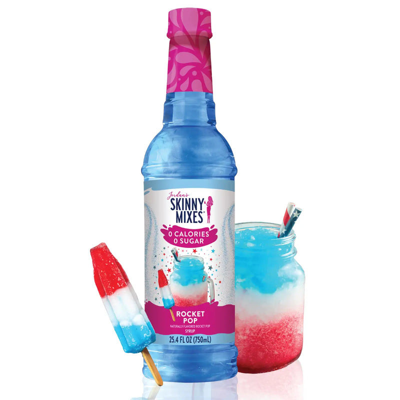 Skinny Mixes Rocket Pop syrup bottle with a popsicle and a jar of the drink on a white background
