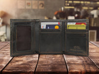 Open leather wallet with cards on a wooden surface, blurred background