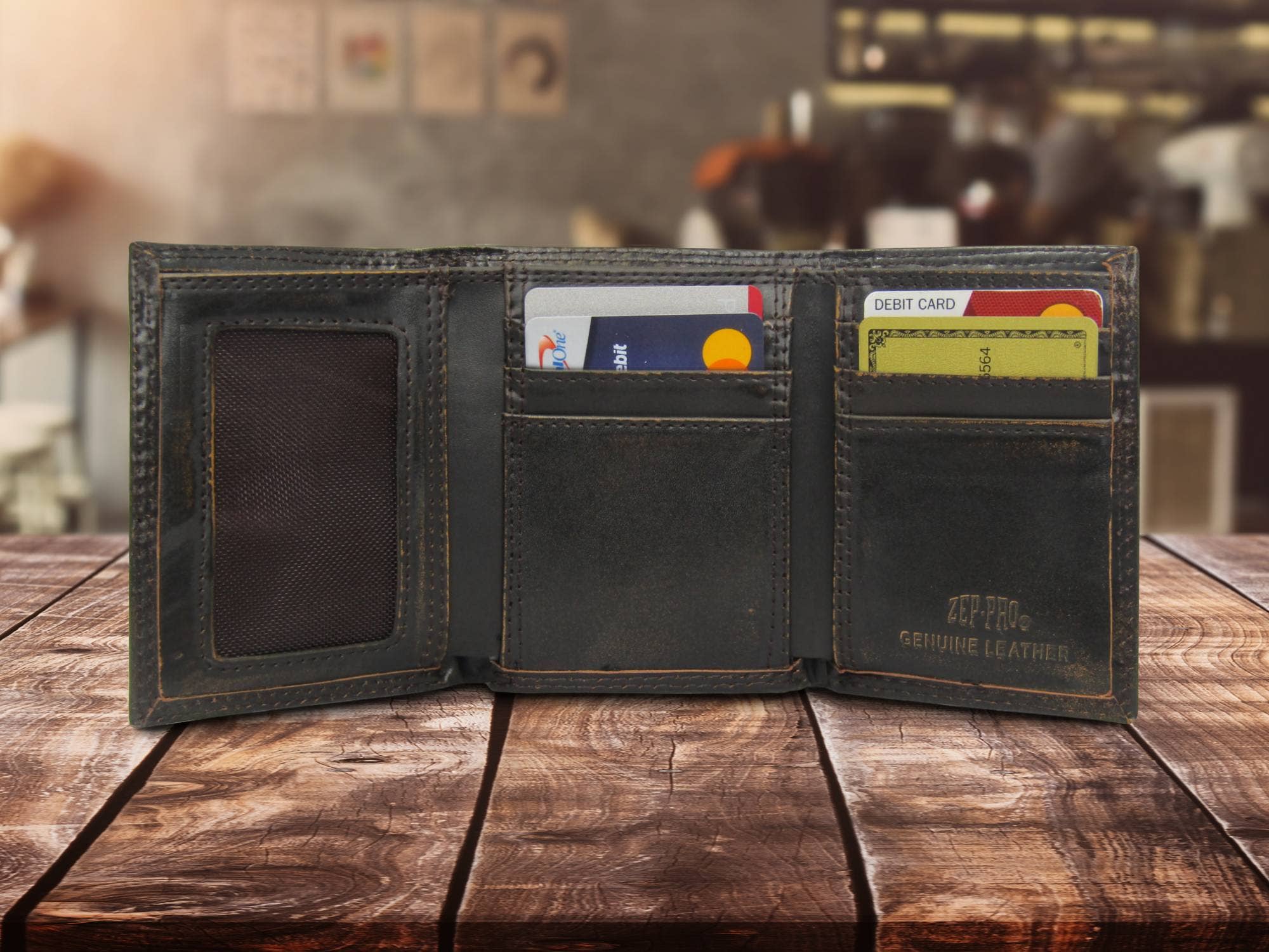 Open leather wallet with cards on a wooden surface, blurred background