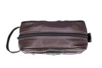 Brown leather toiletry bag with zippers on a white background
