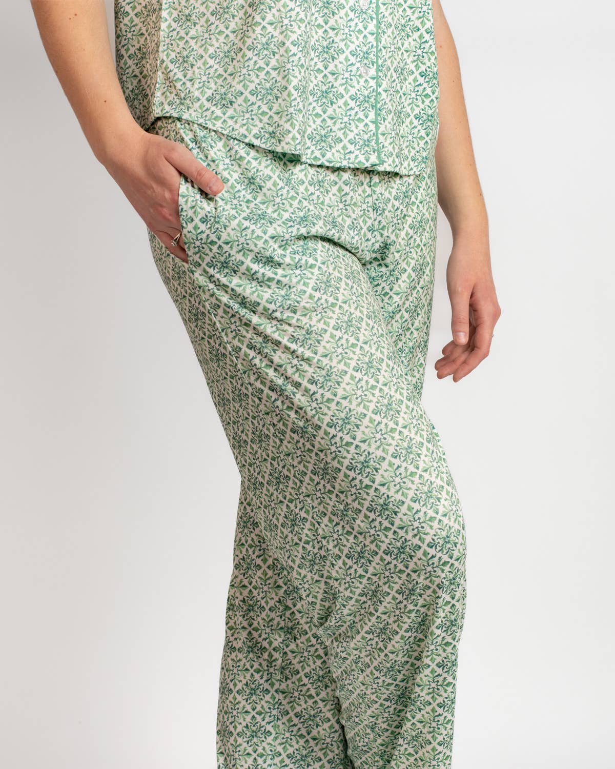 Green patterned pajama set on a plain background
