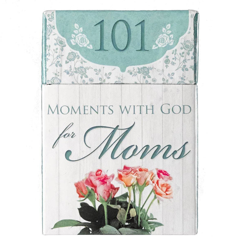 Book titled '101 Moments with God for Moms' with floral design on a white background