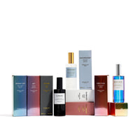 Collection of perfume bottles and boxes on a white background