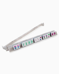 Stack of white mahjong pushers with colorful labels on a white background