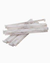 Stack of white mahjong pushers on a white background