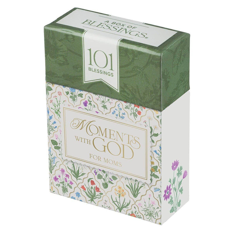 Box of 'Moments with God for Moms' booklets with floral design and text on a white background