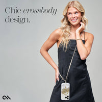 Woman wearing a black dress with a crossbody bag, text 'Chic crossbody design' on gray background