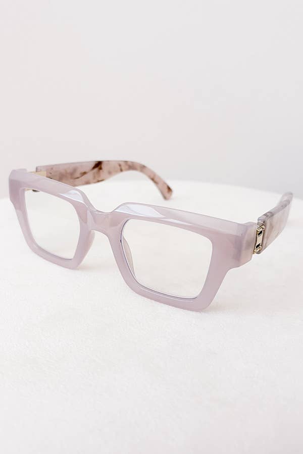 Pink eyeglasses on a white background